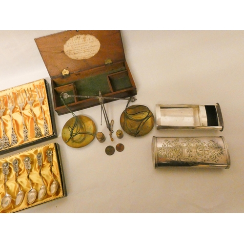 516 - A large engraved silver plated vesta case and a set of jewellers scales in fitted box together with ...