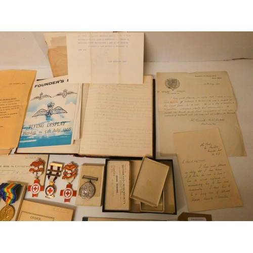 752 - A RAF flight log and other RAF ephemera to include two British Red Cross Society First Aid Medals, o... 