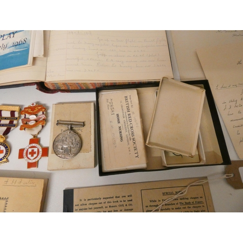 752 - A RAF flight log and other RAF ephemera to include two British Red Cross Society First Aid Medals, o... 