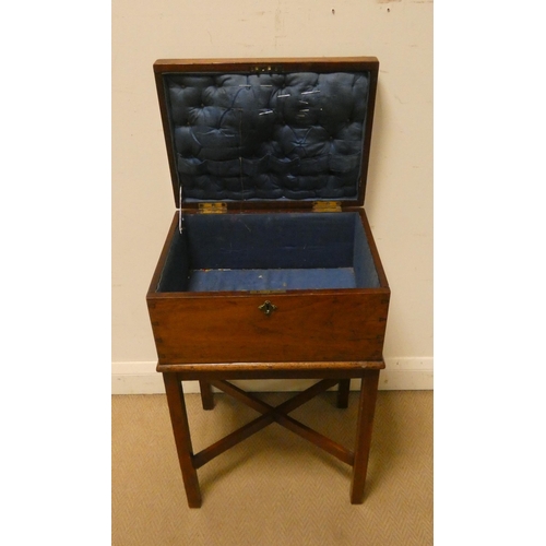 10 - A Victorian mahogany box on a stand with cross stretchers, lined as a workbox...