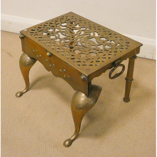 19 - A heavy pierced Victorian brass trivet on shaped feet, 18