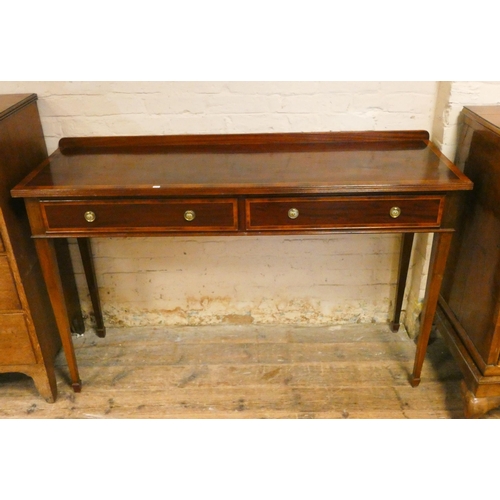 20 - A Georgian style mahogany serving table fitted two drawers with cross banded top, standing on square...