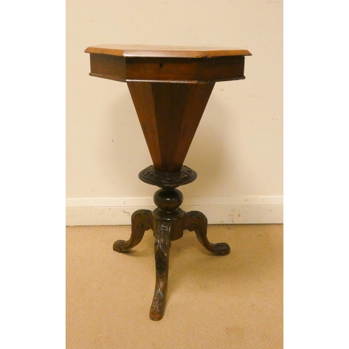 28 - A Victorian octagonal inlaid walnut worktable on tripod base...