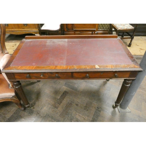 32 - A Victorian mahogany writing table fitted two drawers on turned legs, 4' wide...