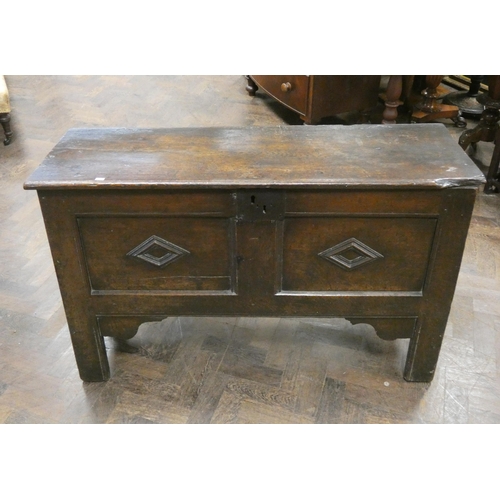 35 - An antique oak two panelled coffer, 46