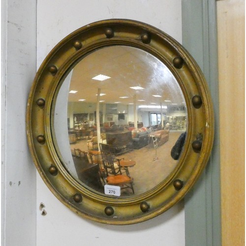 270 - A regency style circular convex wall mirror in a beaded gilt frame, diameter 14