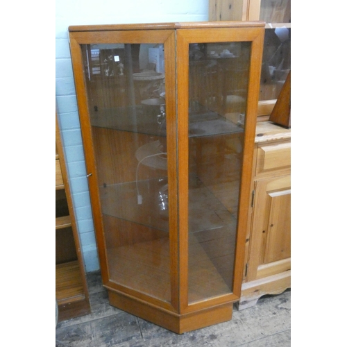 61 - A teak glazed corner display cabinet...