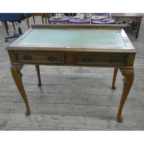 100 - A walnut writing table fitted two drawers with green leather top standing on cabriole style legs, 3'... 