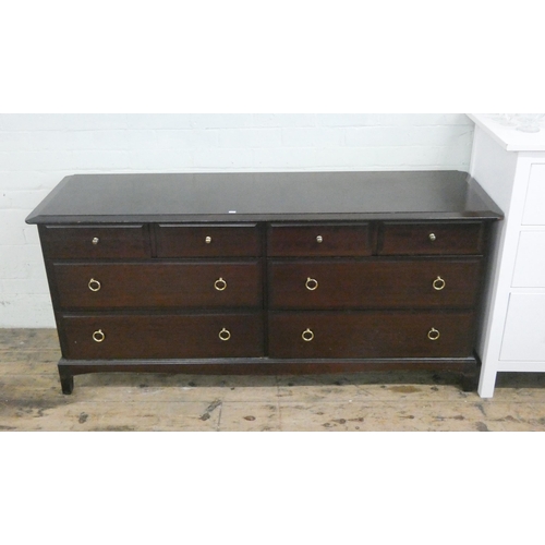 60 - A long stag minstrel mahogany chest of four long and four short drawers, 62