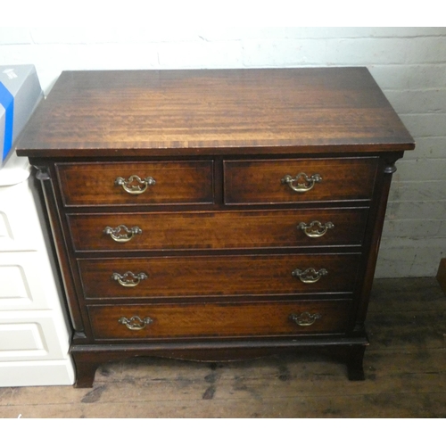 74 - A Georgian style mahogany chest of three long and two short drawers with brass handles and a cross b... 