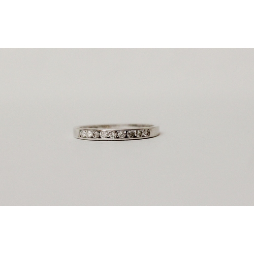 593 - 18ct white gold diamond half hoop eternity ring, marked 0.25 carat and hallmarked in shank. Ring siz...