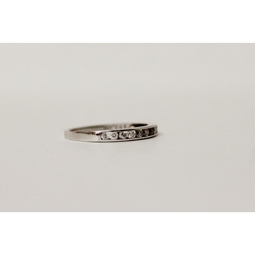 593 - 18ct white gold diamond half hoop eternity ring, marked 0.25 carat and hallmarked in shank. Ring siz...