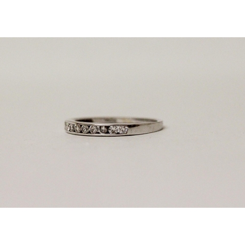 593 - 18ct white gold diamond half hoop eternity ring, marked 0.25 carat and hallmarked in shank. Ring siz...