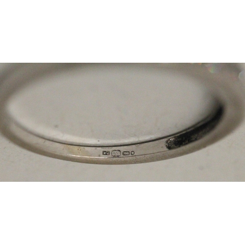 593 - 18ct white gold diamond half hoop eternity ring, marked 0.25 carat and hallmarked in shank. Ring siz...