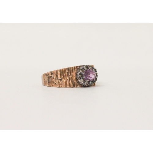 601 - A 9ct rose gold amethyst and diamond oval cluster ring, hallmarked. Ring size T, weight 5 grams.