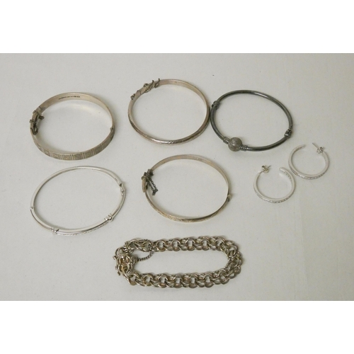 605 - Three hallmarked silver bangles, silver plated and CZ set bangle and hoop earrings and a hallmarked ... 