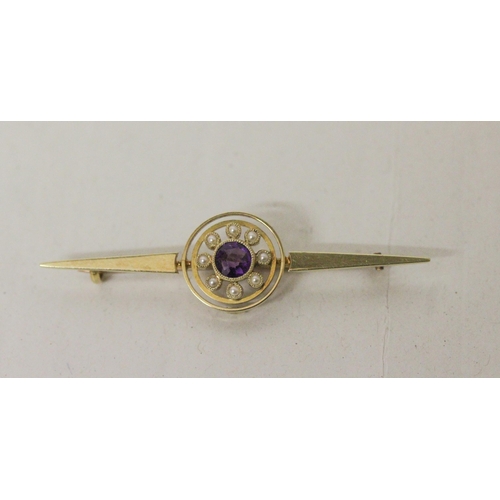 607 - An Edwardian 15ct gold amethyst and seed pearl circular cluster bar brooch. Marked 15ct, 55mm long, ... 