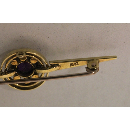 607 - An Edwardian 15ct gold amethyst and seed pearl circular cluster bar brooch. Marked 15ct, 55mm long, ... 