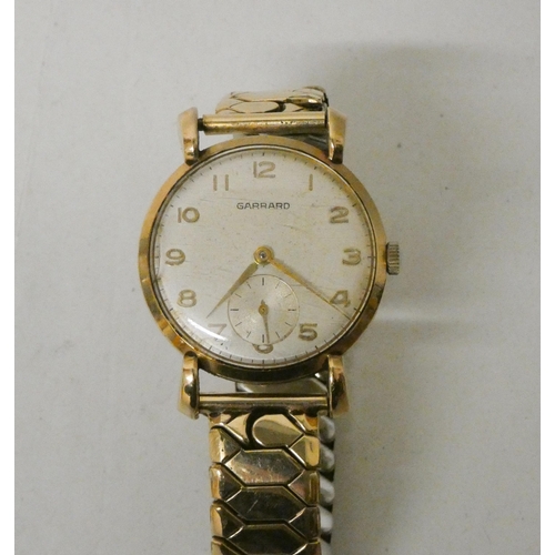 625 - Gents 9ct gold cased Garrard wristwatch, with presentation engraving. On gold plated flexi strap