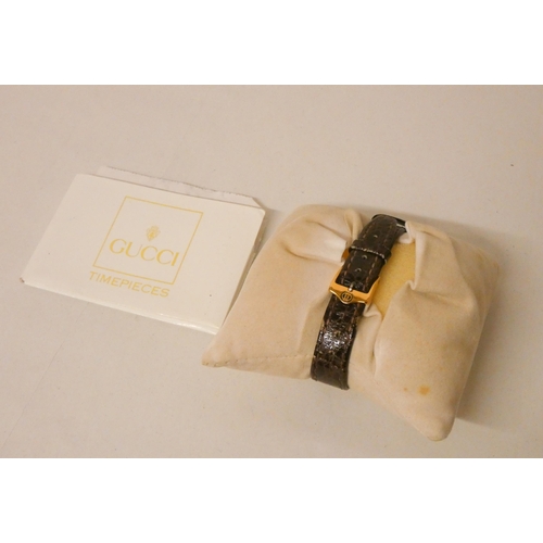 628 - Gucci - ladies quartz wristwatch on brown mock croc strap, with warranty card & purchase receipt.