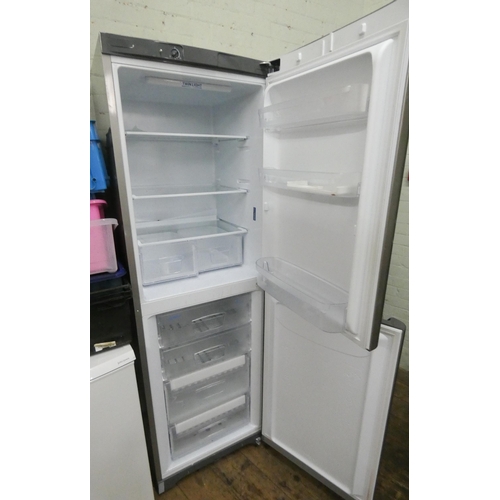 760 - A tall half and half Indesit fridge freezer in silver case