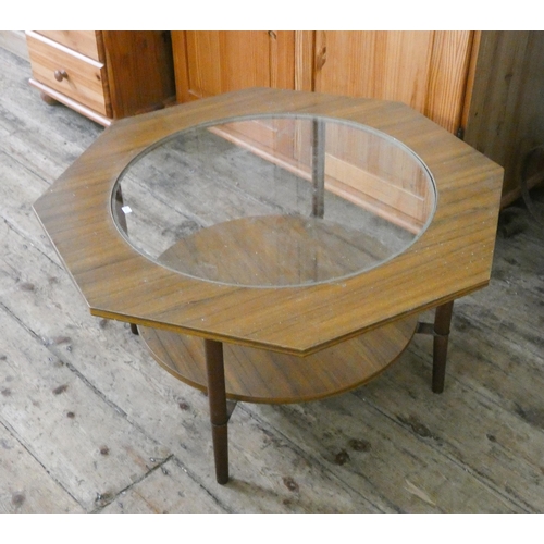 152 - An octagonal teak finished coffee table with inset glass top