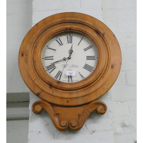 157 - A circular battery wall clock in pine case