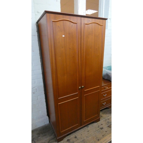 158 - A modern mahogany finished four piece bedroom suite comprising a double door wardrobe, a single pede... 