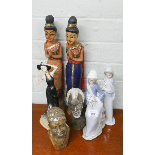 160 - Two Lladro figure ornaments, a pair of wooden Indian figures, a modern figurine of a lady in a hat a... 