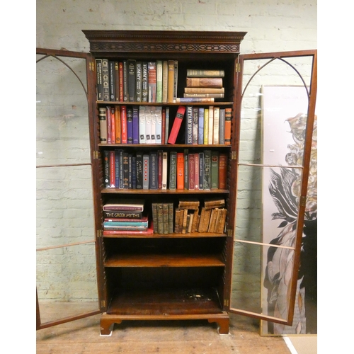 178 - A 1920's mahogany astragal glazed two door bookcase standing approx. 6'6