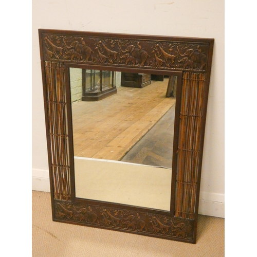 180 - A decorative safari inspired metalwork rectangular wall mirror