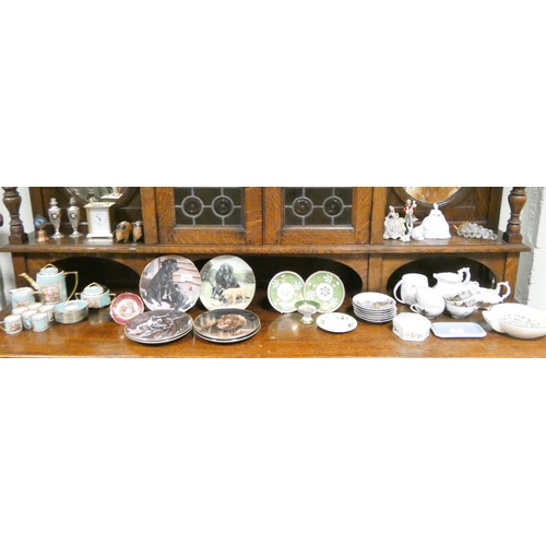 182 - A collection of china to include collectors wall plates, coffee sets, a modern mantel clock etc