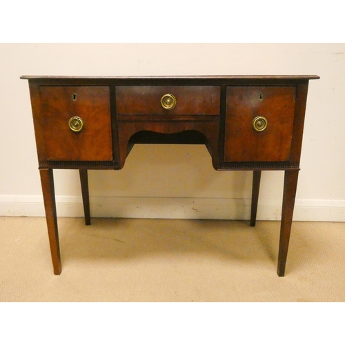 185 - An Edwardian mahogany hall or writing table, fitted one central drawer and deep drawers each side wi... 