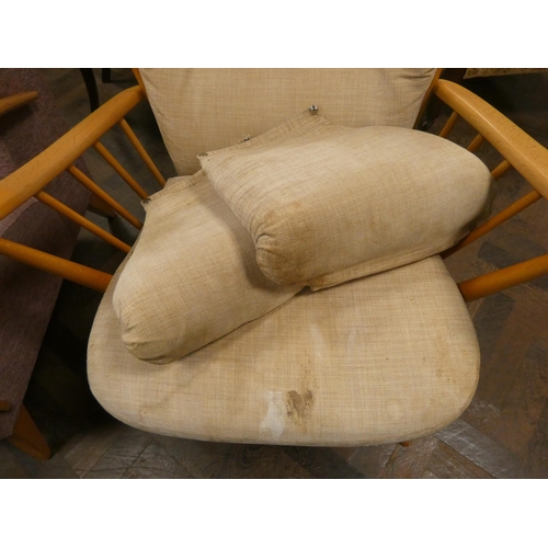 292 - An Ercol comb-backed occasional elbow chair