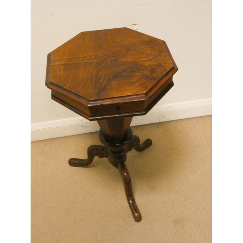 305 - A Victorian walnut octagonal sewing box on a tripod base, lifting lid containing various vintage cot... 