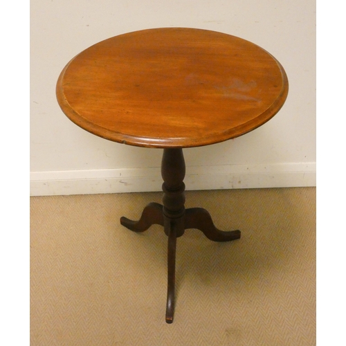 307 - An antique mahogany wine table with a circular top