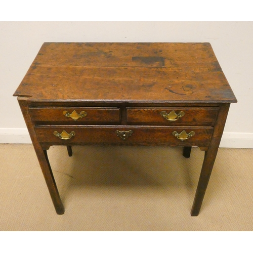 309 - An antique oak hall table fitted two small and one long drawer with brass drop handles and escutcheo... 