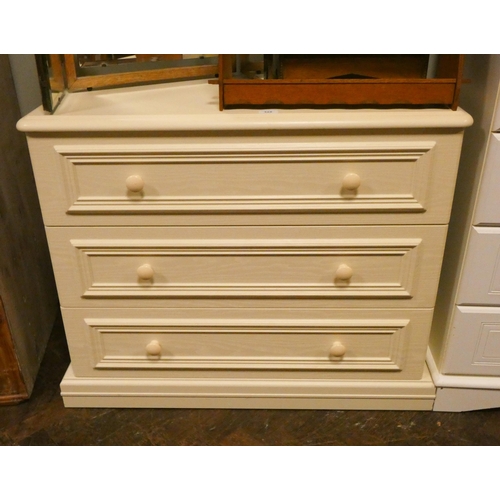 325 - A limed oak effect chest of three long drawers