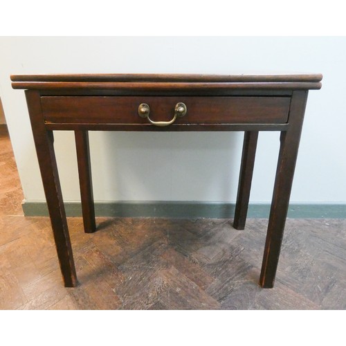 359 - A 19th century mahogany fold over top tea table, fitted one long drawer with a brass handle