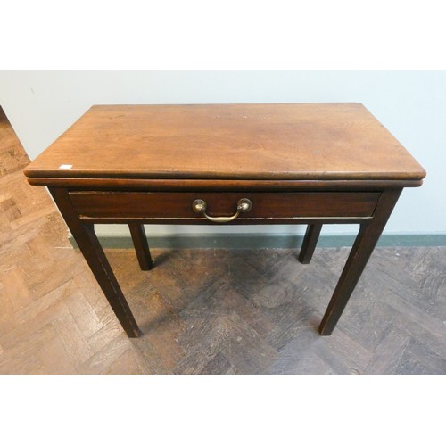 359 - A 19th century mahogany fold over top tea table, fitted one long drawer with a brass handle