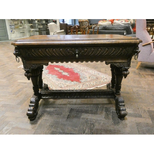 362 - A Victorian highly carved hall or centre table fitted one long drawer, carved with lion mask and rin... 