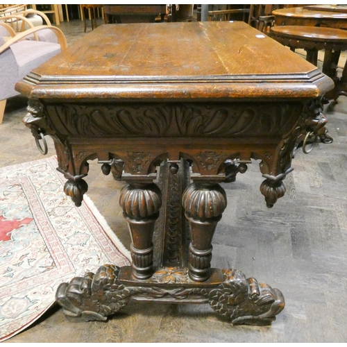 362 - A Victorian highly carved hall or centre table fitted one long drawer, carved with lion mask and rin... 