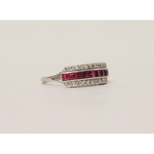 551 - An Art Deco ruby and diamond triple-row half eternity ring, circa 1925, channel and pave set with ca...