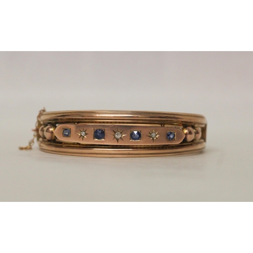 541 - Late 19th century 9ct rose gold sapphire and diamond bangle. unmarked. With box clasp and safety cha... 