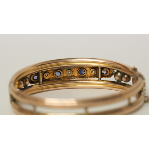 541 - Late 19th century 9ct rose gold sapphire and diamond bangle. unmarked. With box clasp and safety cha... 