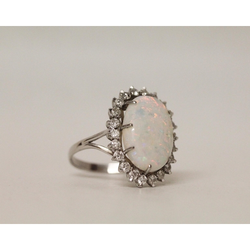 544 - A large and impressive oval opal and diamond cluster ring, on 18ct white gold band, ring size P/Q, 7...