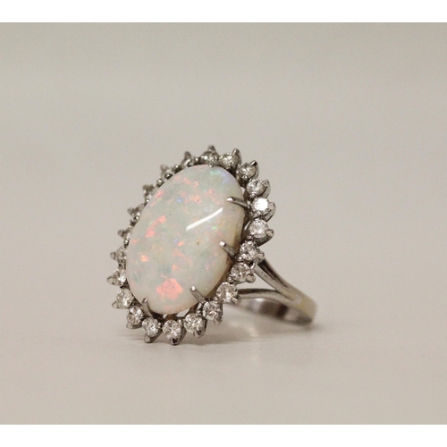 544 - A large and impressive oval opal and diamond cluster ring, on 18ct white gold band, ring size P/Q, 7...