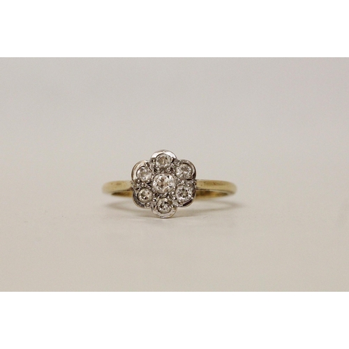 558 - An 18ct yellow gold diamond daisy cluster ring, hallmarked, ring size T, 4.2 grams...