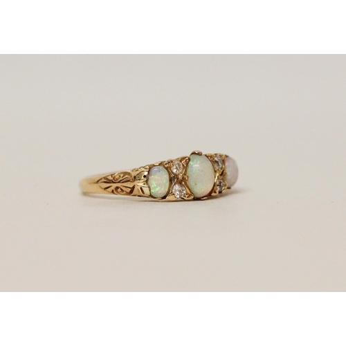 560 - An antique 18ct gold three stone opal and diamond half hoop ring, ring size O, 3.3 grams...