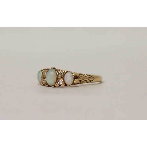 560 - An antique 18ct gold three stone opal and diamond half hoop ring, ring size O, 3.3 grams...